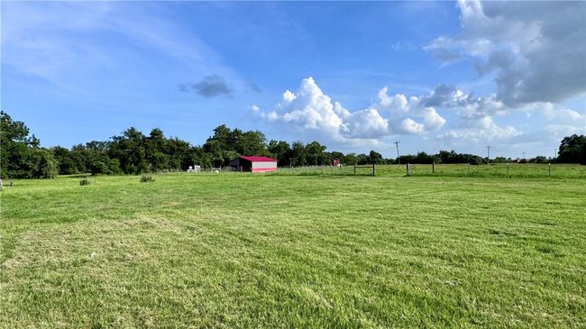 View of green lawn with a view of rural / pastoral area | Image 23