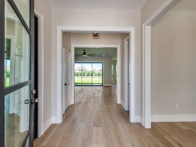 Entryway with study office on left behind iron glass doors | Image 8