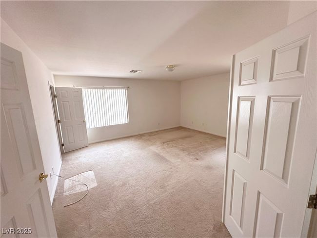 Carpeted spare room featuring baseboards | Image 23
