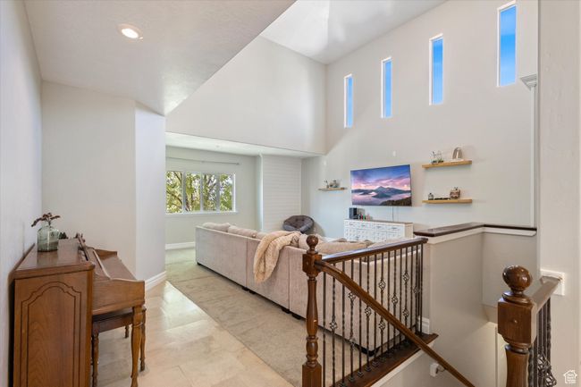 Living room featuring a towering ceiling and recessed lighting | Image 10