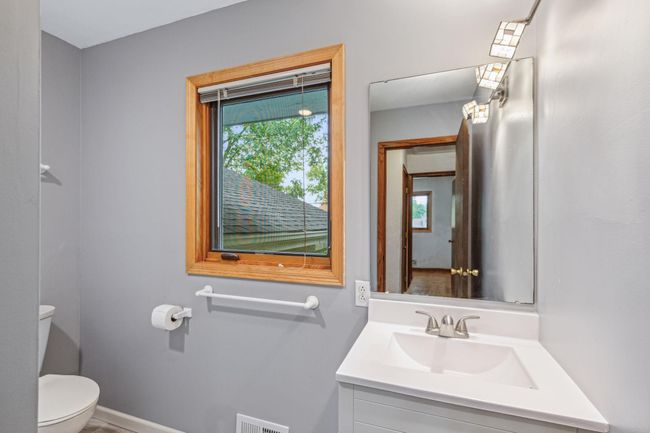 New vanity, flooring and tile in upper level bath. | Image 26