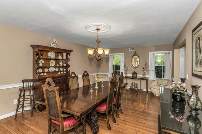 Huge Formal Dining Room featuring Hardwood Floors and Sitting Area | Image 5