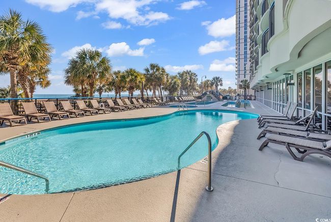 Community pool with a patio | Image 17