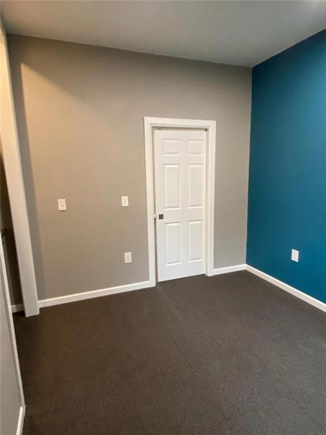Unfurnished bedroom with carpet | Image 9