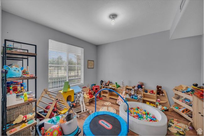 Game room with wood finished floors | Image 26