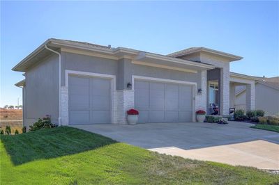 View of front of property with a front lawn and a garage | Image 3