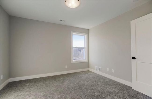 Spare room featuring carpet floors and baseboards | Image 21