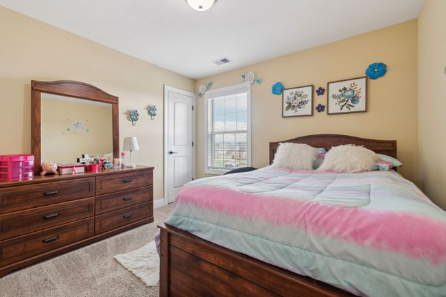 The third bedroom features soft carpet flooring and a single window! 1107 Sycamore Leaf Way Murfreesboro, TN 37129 | Image 26