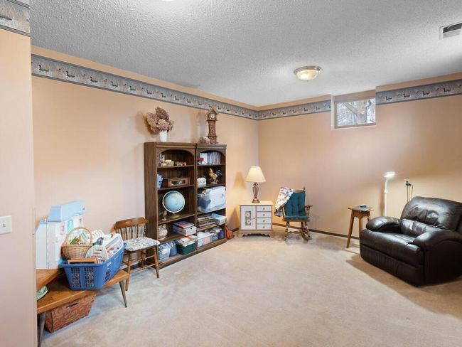 Well-placed 3/4 bath on the main floor, right by the mudroom, flex-room, and kitchen—great for busy households. | Image 32