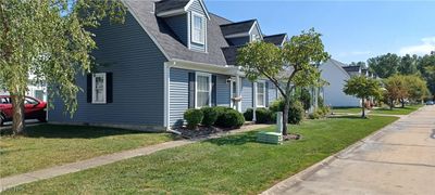 View of property exterior featuring a yard | Image 2