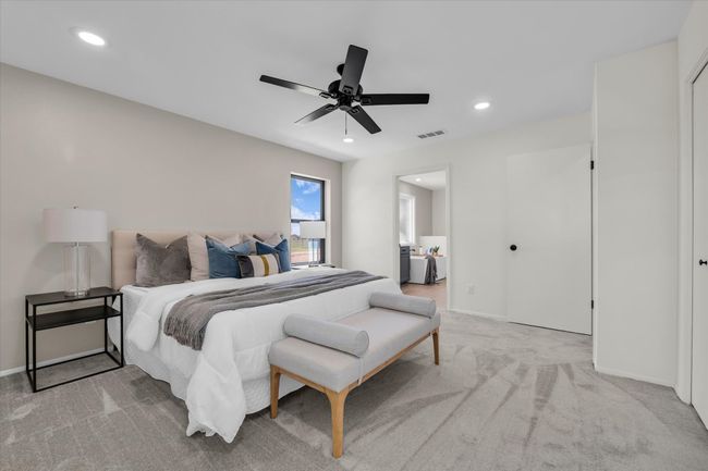 Carpeted bedroom featuring baseboards, a ceiling fan, visible vents, and recessed lighting | Image 37