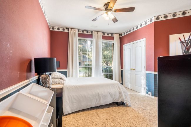 Bedroom featuring carpet, a closet, and ceiling fan | Image 21