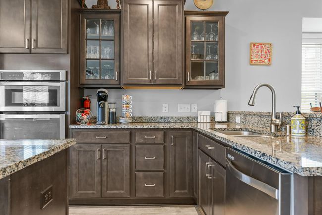 Larger kitchen offers space for additional 3 cabinets shown in photo. | Image 14