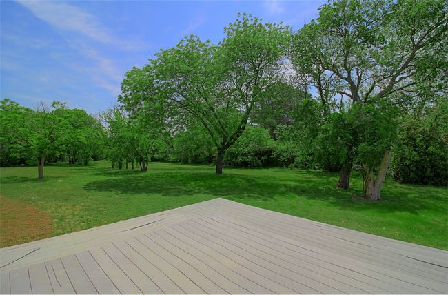 Wooden terrace featuring a yard | Image 22