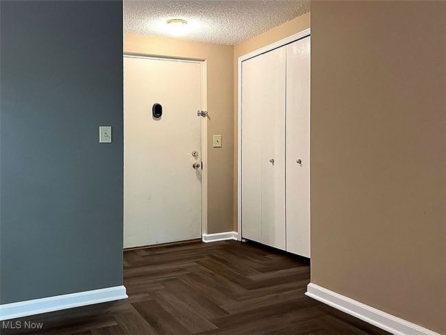 Inside safety entryway featuring baseboards and a textured ceiling | Image 21