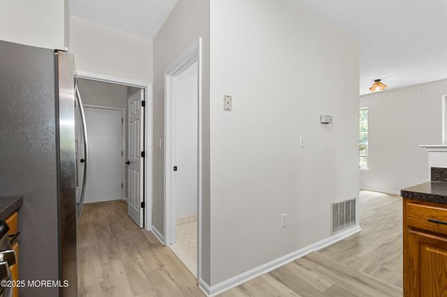 Kitchen to Half Bath, Laundry Room and Garage entrance | Image 18