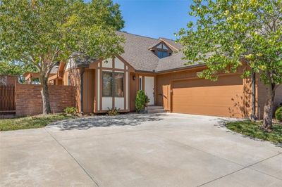 View of front facade with a garage | Image 1