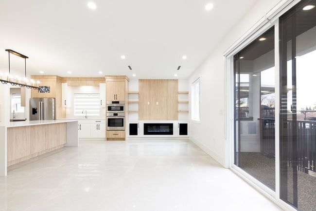 Unfurnished living room with recessed lighting and baseboards | Image 9