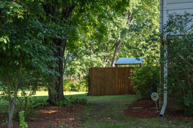 Wood fence blocks the grilling area | Image 42