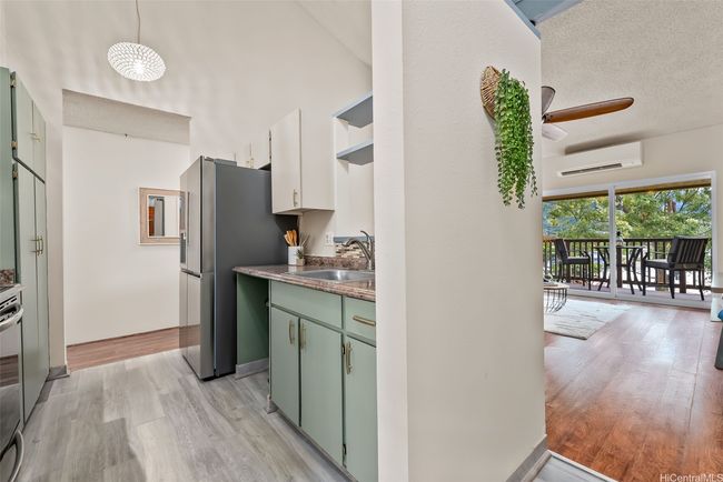 The unit featuredVaulted ceilings and generous natural light enhance the spacious feel of the unit | Image 4