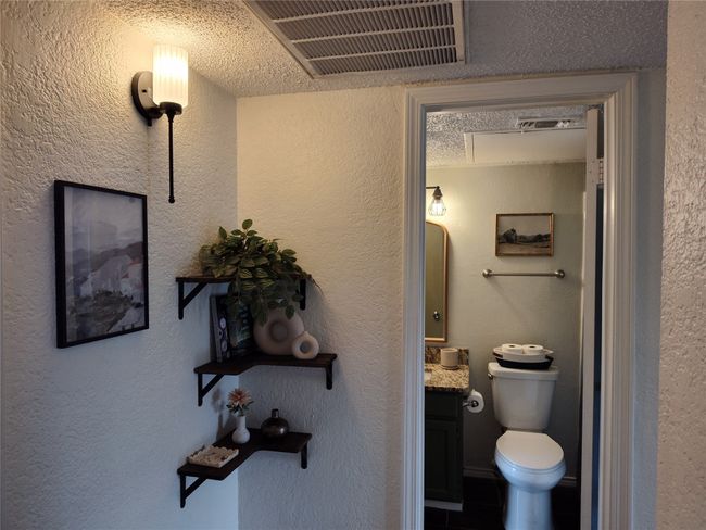Bathroom with toilet, and vanity | Image 7