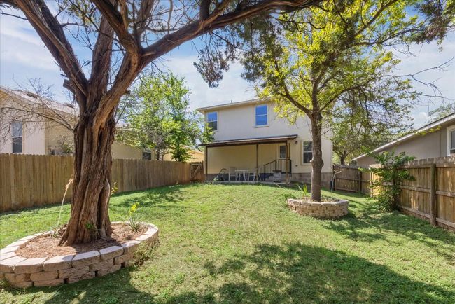 View of fenced backyard | Image 11