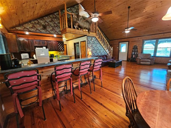 View of the Kitchen and Stairway from the Dining Area | Image 11