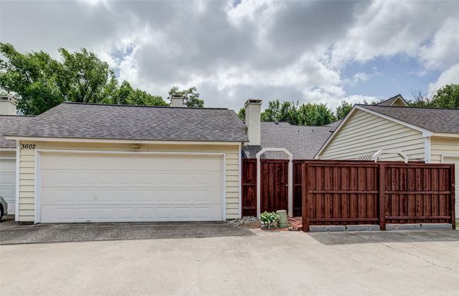 View of front of house with a chimney, a shingled roof, and a garage | Image 29