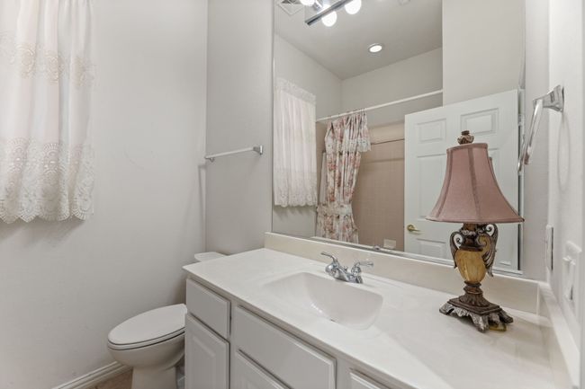 Bathroom with vanity, toilet, and walk in shower | Image 34