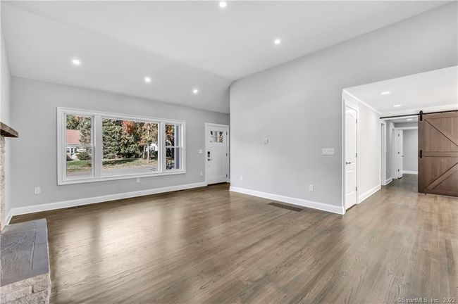 Luminous vaulted ceilings encompass the Living and Kitchen area. | Image 10