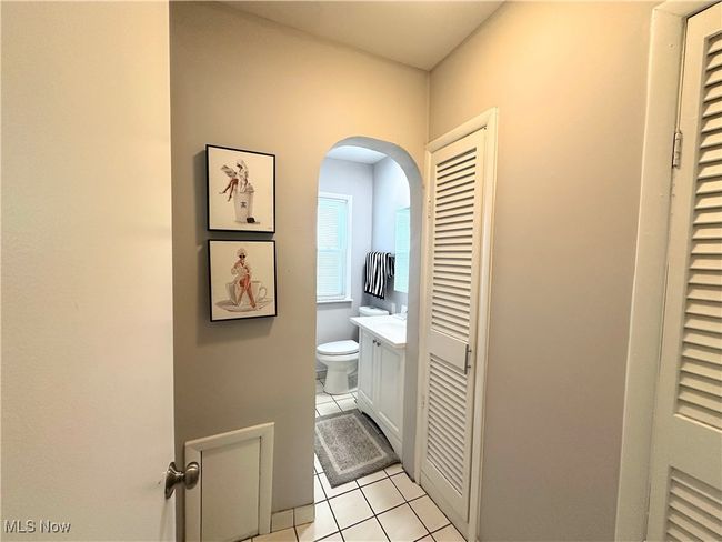 Bathroom with tile patterned floors, vanity, a heating unit, and toilet | Image 5