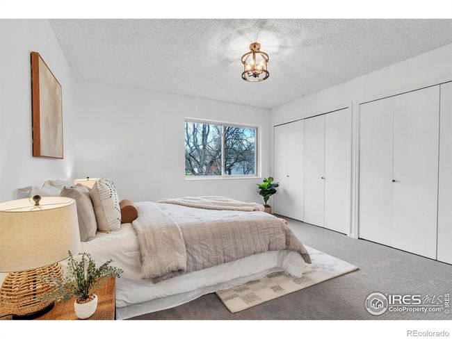 Primary bedroom with seasonal mountain views and plenty of closet space | Image 18