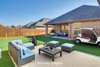 View of patio / terrace with an outdoor hangout area | Image 2