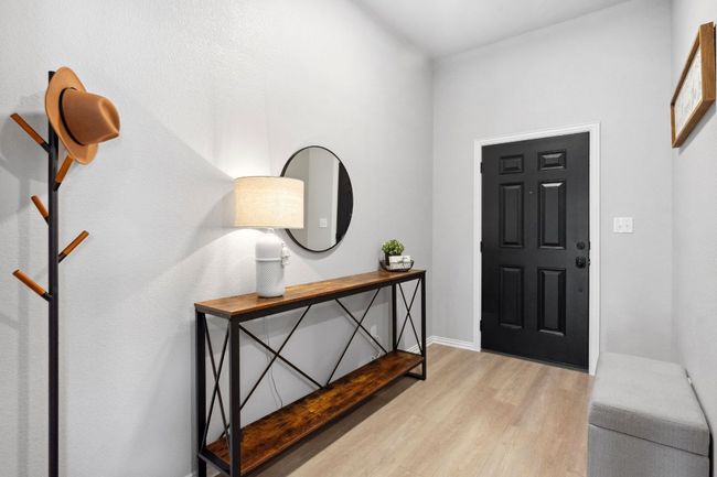 The foyer welcomes you to a freshly painted interior. | Image 4
