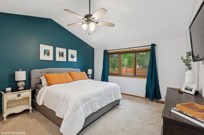 Upper-level primary bedroom with a pitched ceiling that makes the space feel even more open and bright | Image 22