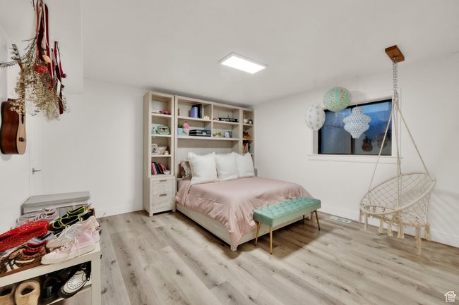 Bedroom featuring wood finished floors | Image 33