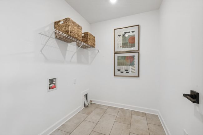 (Photo of model home, actual features may vary) Centrally located on the upper level, along with the four bedrooms, this laundry room is sure to provide the ultimate convenience. | Image 15