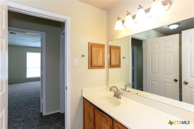 Hall bathroom showing the​​‌​​​​‌​​‌‌​‌‌​​​‌‌​​‌‌​‌​​​​​‌ hallway. | Image 24