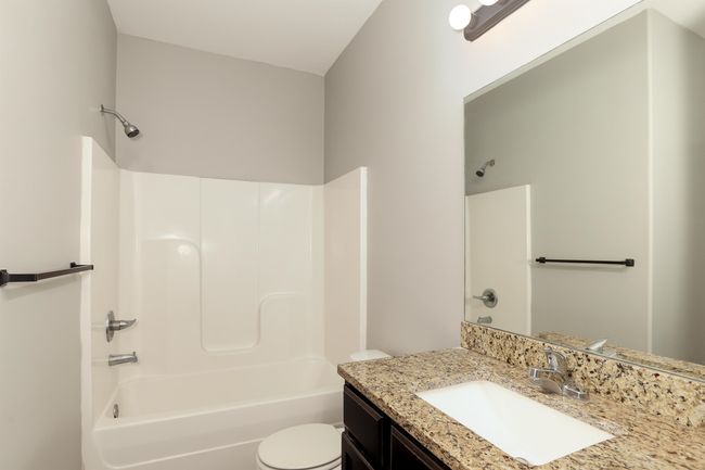 Full bathroom with vanity, toilet, and shower / bath combination | Image 16