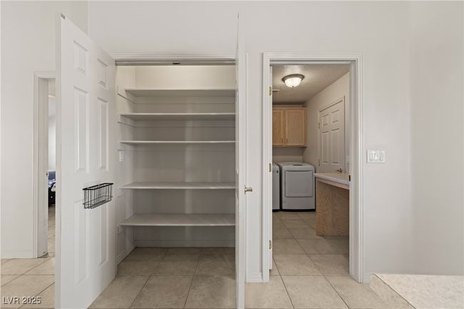 Pantry featuring washer and dryer | Image 21
