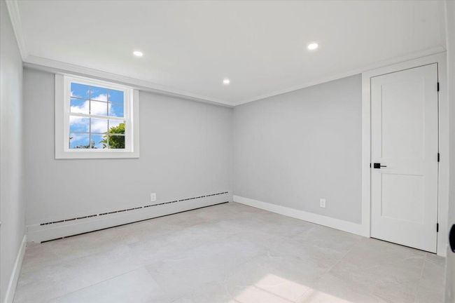 Unfurnished room featuring baseboard heating and recessed lighting | Image 26