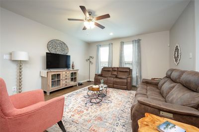 Living room featuring hardwood / wood-style flooring and ceiling fan | Image 3