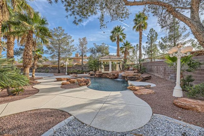 View of swimming pool featuring a patio area, a fenced backyard, and a gazebo | Image 52