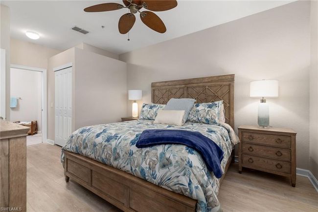 Bedroom featuring ceiling fan, light hardwood / wood-style floors, and a closet | Image 11