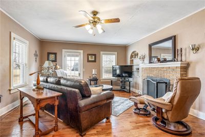 Living room w/ original hardwood floors and lots of natural light | Image 3