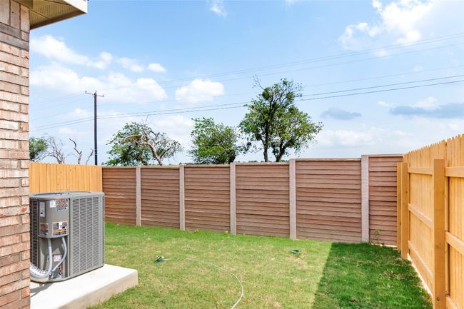 View of yard featuring central AC unit and fence | Image 27