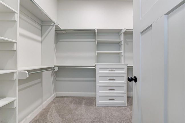 Primary closet with built-ins and plenty of storage. | Image 20