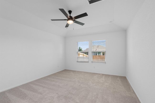Spare room with light colored carpet and ceiling fan | Image 11