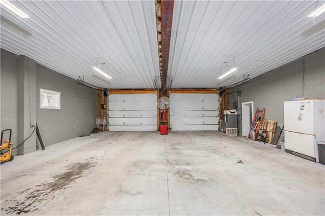 Garage with freestanding refrigerator | Image 51