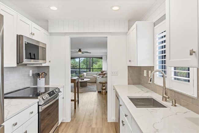KITCHEN LOOKING OUT TO DINING/LIVING | Image 18